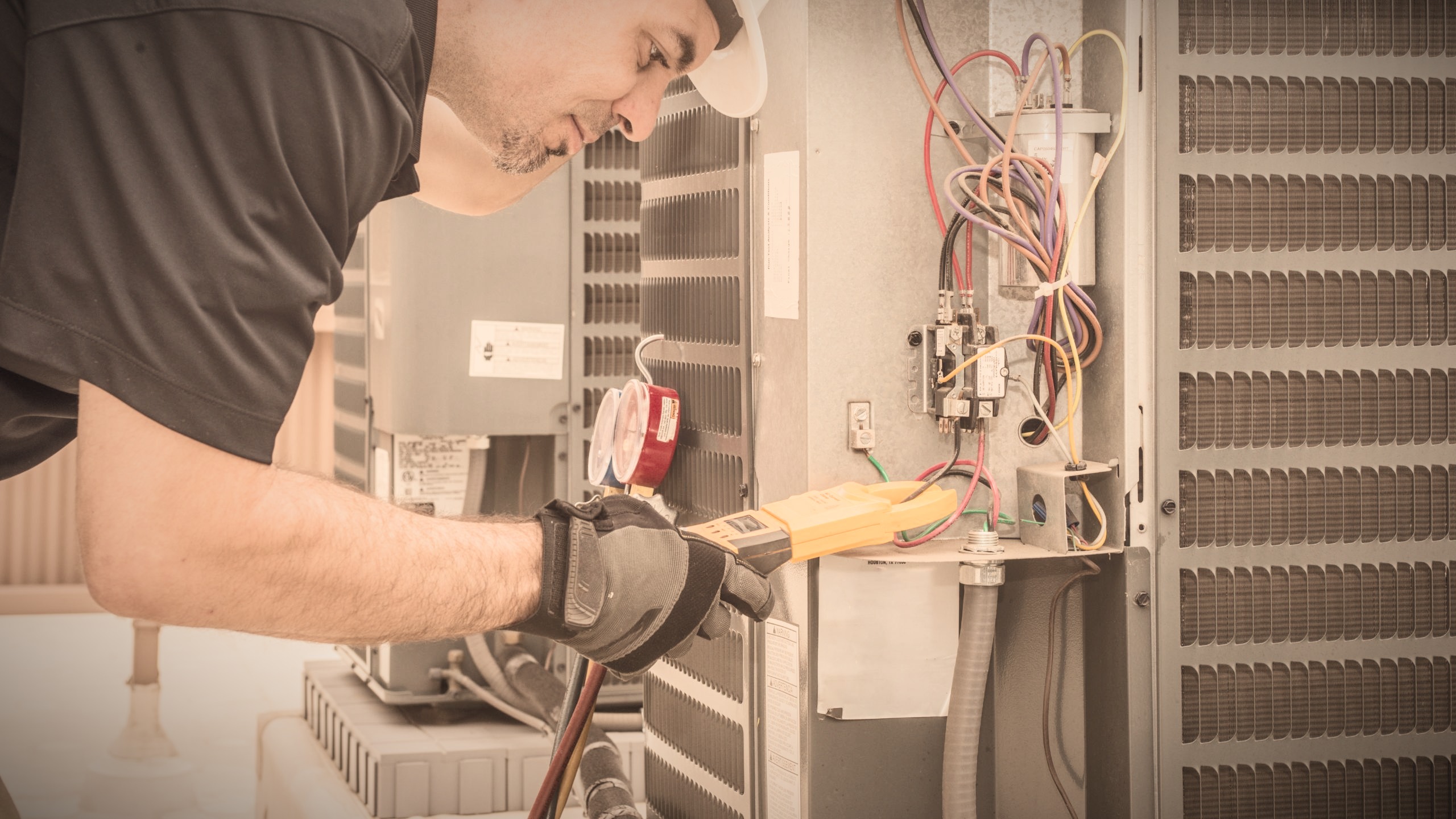 Day and Night Airtech technician at work on an HVAC unit